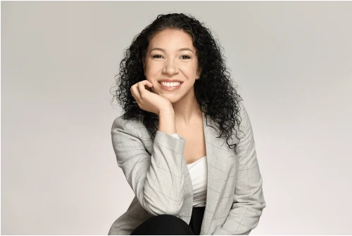 Adelita Aguirre in a gray blazer against a gray background