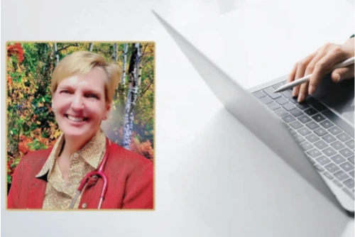 Dr. Kim Paxton smiles at the camera, she has short blonde hair and is wearing a red blazer